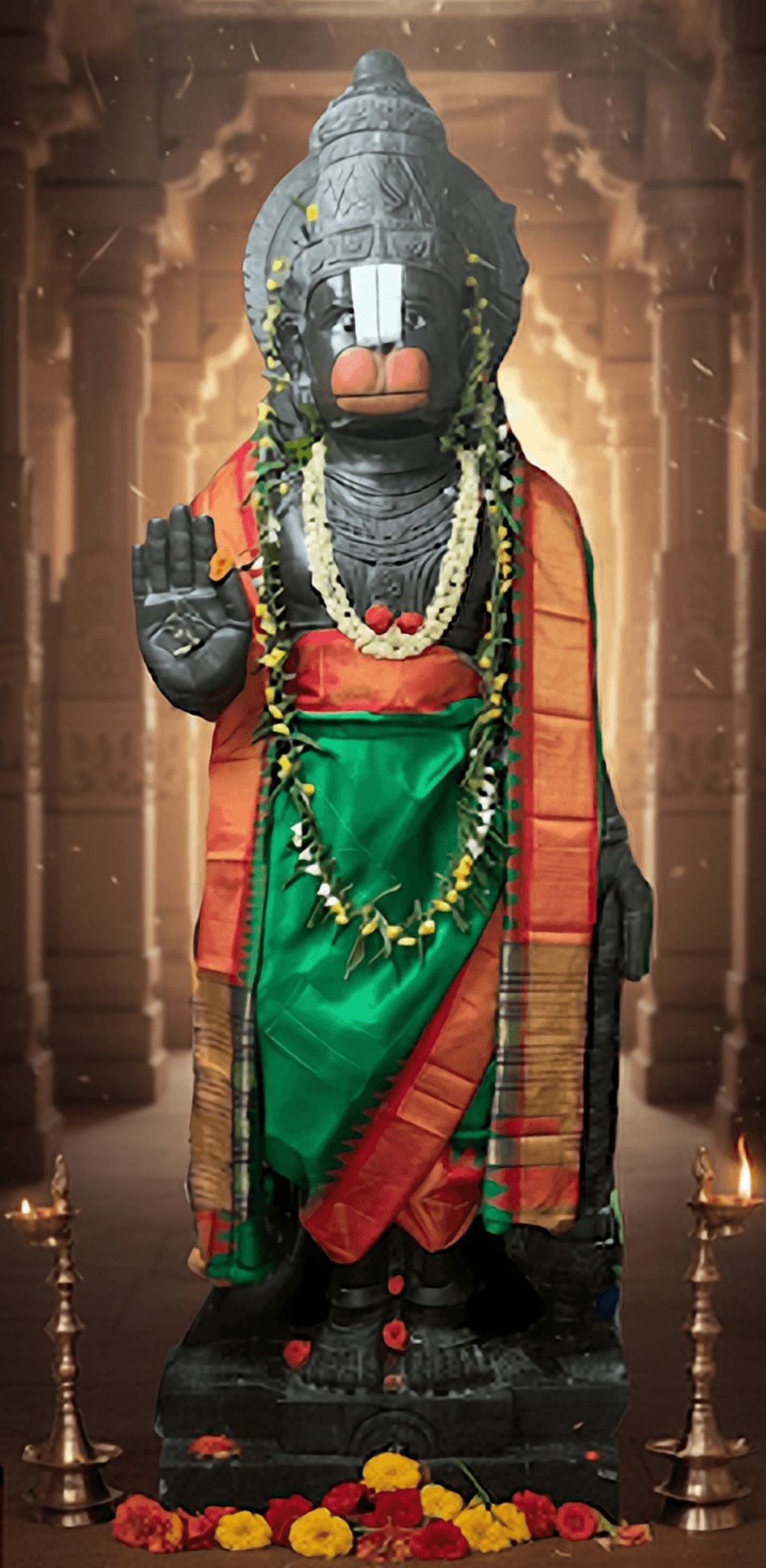 The Salagrama Yanthrodharaka Hanuman deity at HRIM Center, adorned with garlands